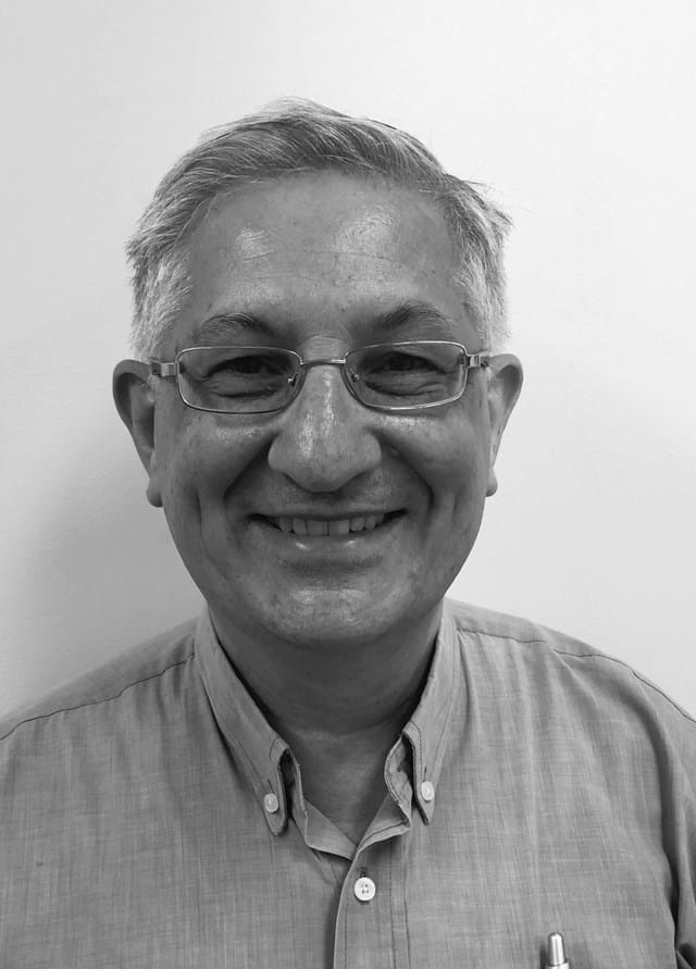 Dr. Andrew Melito smiling in professional attire at Kildare Road Medical Centre